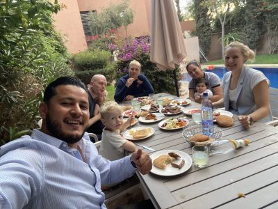 Travelers learning traditional crafts from local artisans during authentic tours Marrakech experiences in hidden medina workshops