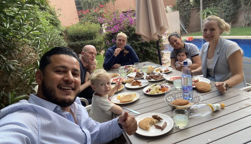 Travelers learning traditional crafts from local artisans during authentic tours Marrakech experiences in hidden medina workshops