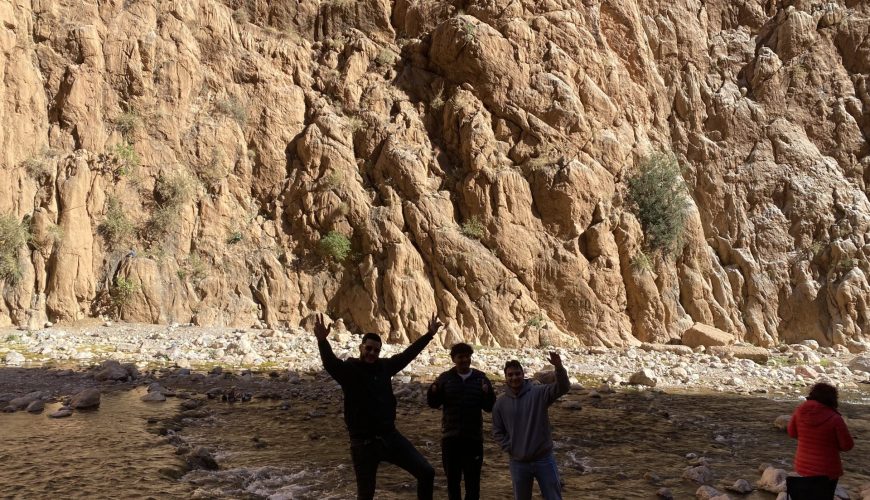 Travelers learning Berber traditions from local elders during cultural heritage tours Ouarzazate exploring ancient kasbah architecture