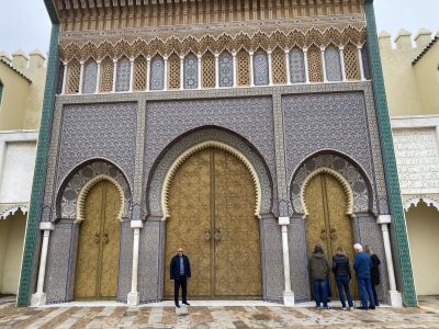 Travelers exploring ancient kasbahs and desert gates during comprehensive tours Ouarzate showcasing Berber heritage