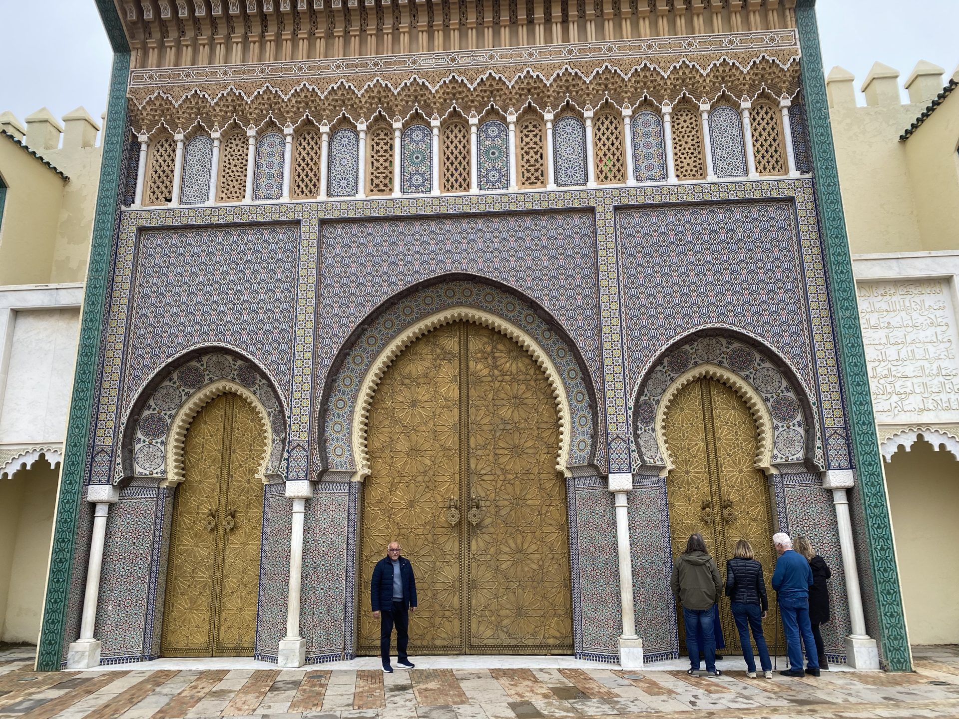 Travelers exploring ancient kasbahs and desert gates during comprehensive tours Ouarzate showcasing Berber heritage